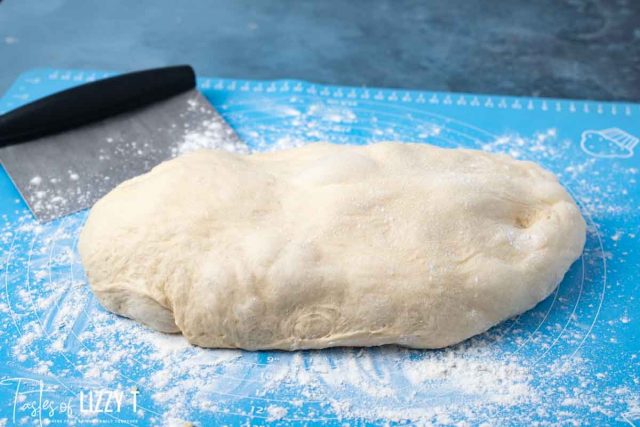 dough for hamburger buns on a pastry mat