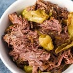 bowl of shredded mississippi pot roast with pepperoncinis