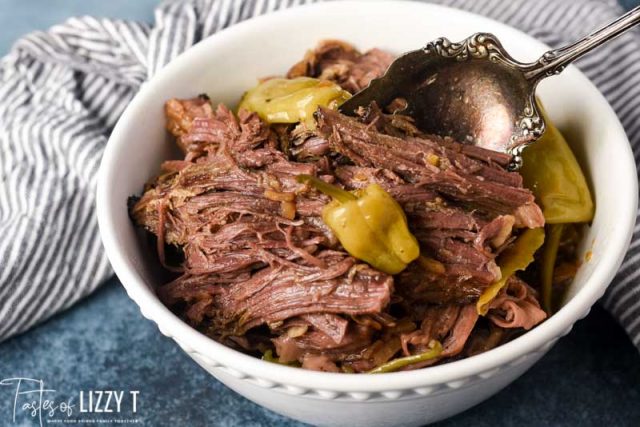 bowl of misissippi pot roast with a spoon in it