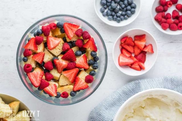 fresh berries and cake in a trifle dish