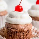 unwrapped chocolate angel food cupcakes with a cherry
