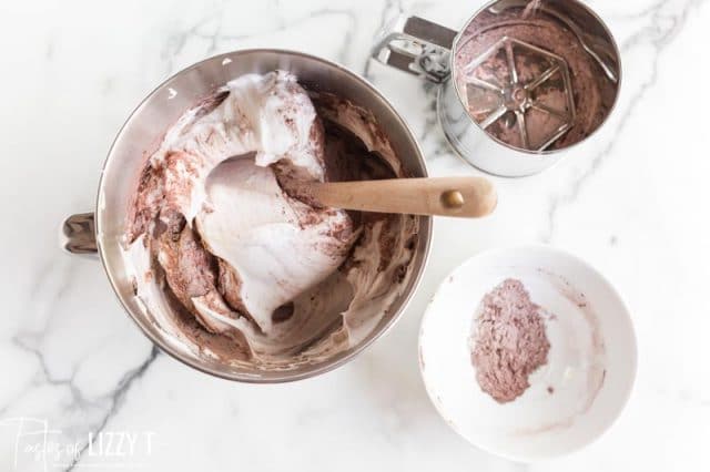 folding cocoa and flour into whipped egg whites