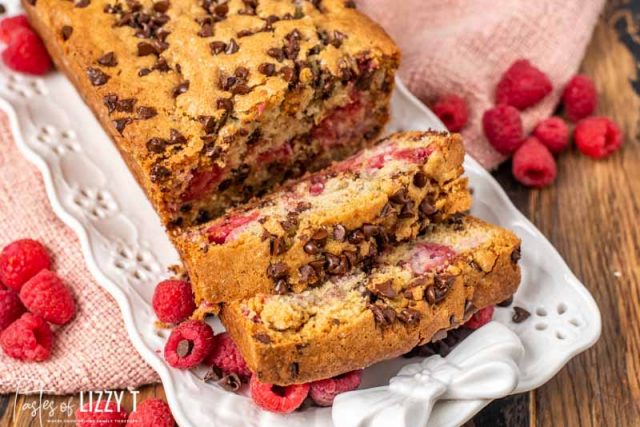 loaf of chocolate chip raspberry bread with two slices cut