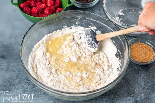 mixing flour and egg mixture in bowl