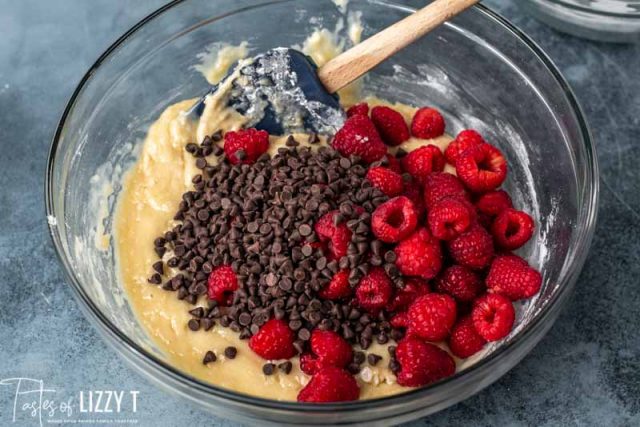 chocolate chips and raspberries on quick bread batter