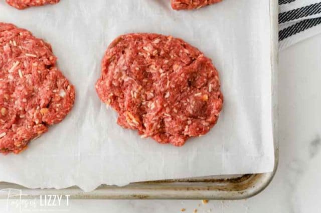 burger patties on parchment paper