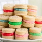 stack of cream wafer sandwich cookies on a plate