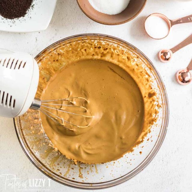 whisk frothing instant coffee in bowl