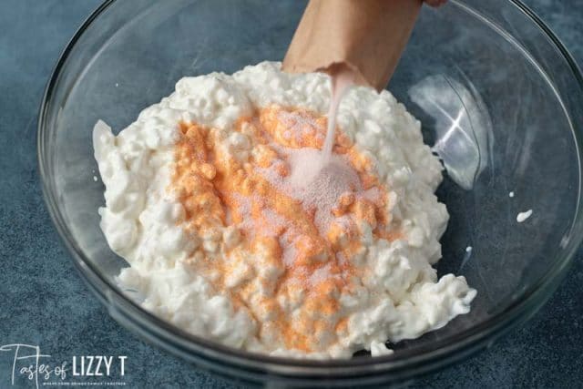 jello being poured into cottage cheese