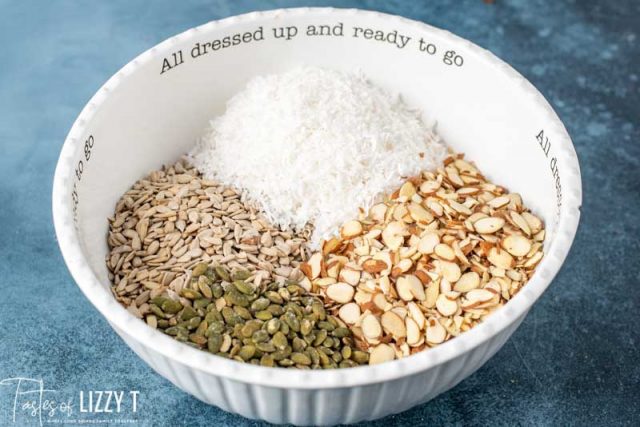 almonds, coconut, sunflower seeds and pepitas in a bowl