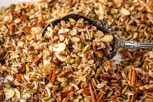 paleo granola on a baking sheet with a spoon