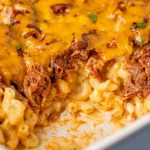 pulled pork mac and cheese in a casserole dish