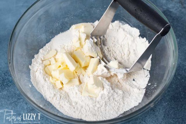 chunks of butter sitting on flour