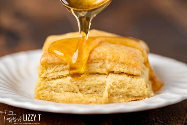 honey pouring on a biscuit
