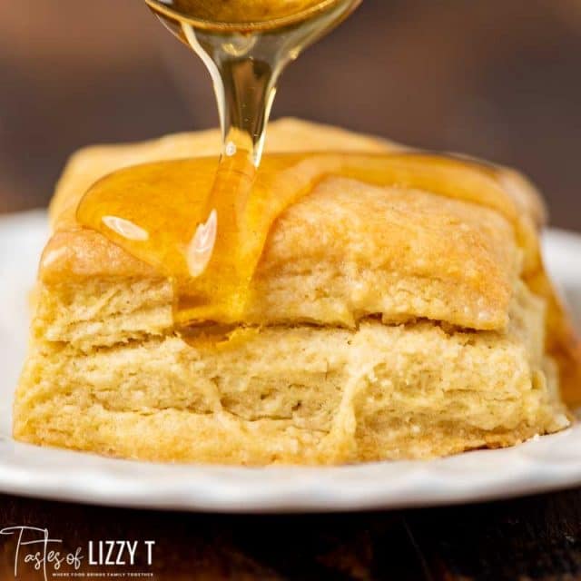 honey pouring on sourdough biscuits