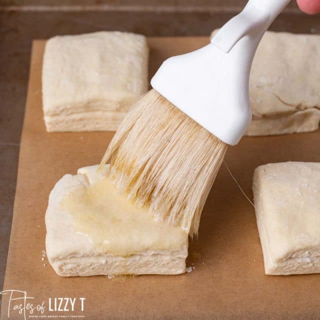 butter brushed on unbaked biscuit