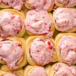 overhead view of frosted strawberry sweet rolls