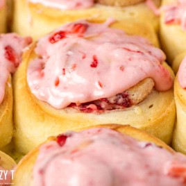 closeup of strawberry frosted sweet roll