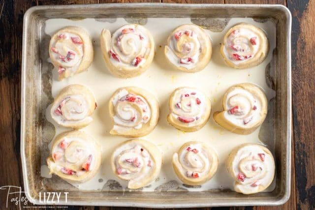 overhead view of unbaked rolls with cream