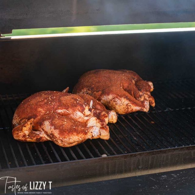 whole chickens on a grill