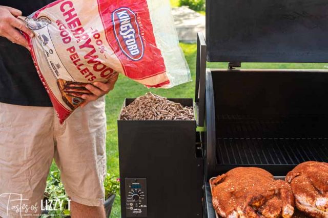 cherrywood pellets pouring into a grill