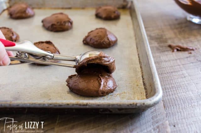 scooping batter on a baking sheet