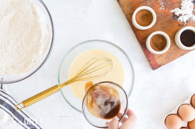 pouring brown butter in a mixing bowl