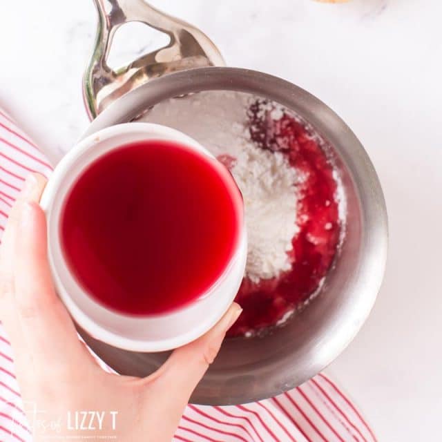 pouring juice into cherry pie filling