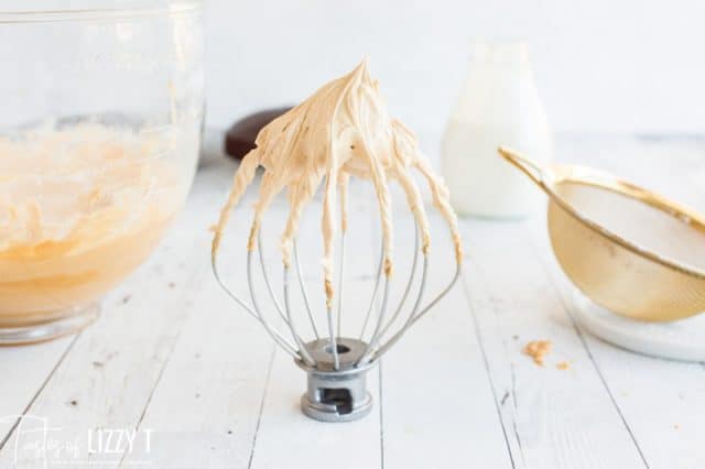 peanut butter frosting on a whisk