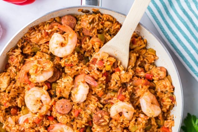 easy one pot jambalaya with a wooden spoon