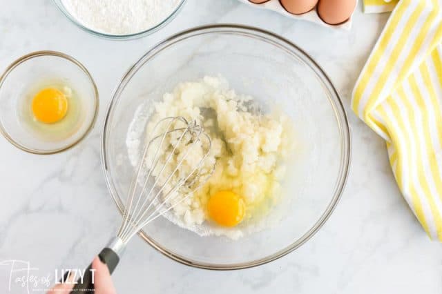 whisking egg into creamed butter and sugar mixture