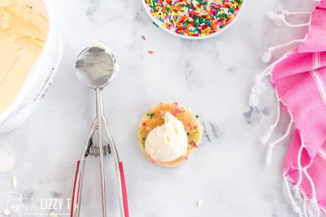 scooping vanilla ice cream on a cookie