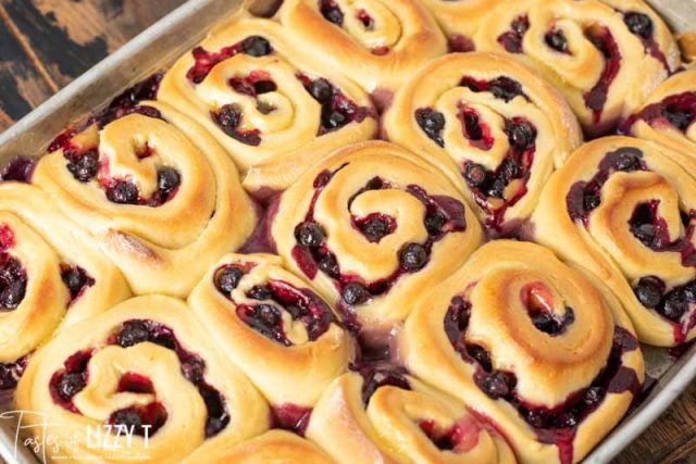 lemon blueberry rolls in a baking pan