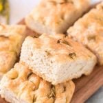 pile of no knead focaccia bread on a cutting board