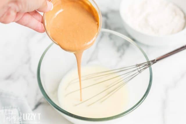 peanut butter pouring into pancake batter