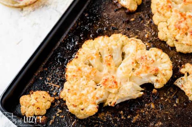 roasted cauliflower steak on a baking pan