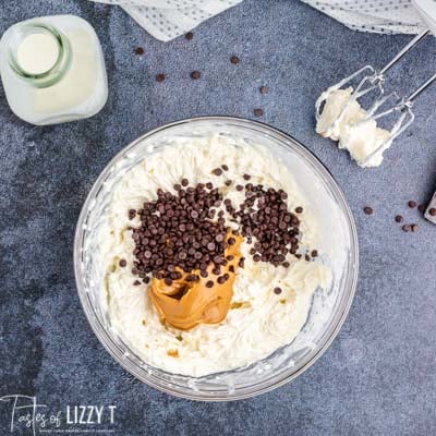 mixing up peanut butter cheesecake dip in bowl