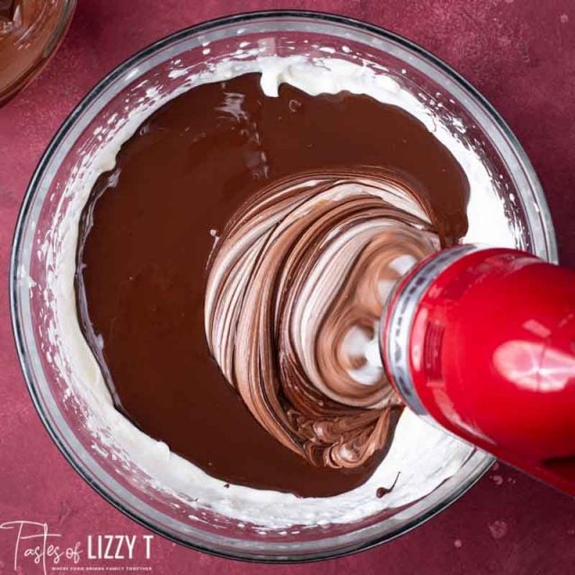 mixing chocolate into cheesecake batter