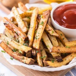 plate of french fries and a cup of ketchup
