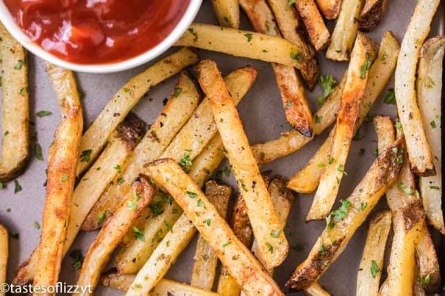 golden brown french fries on a baking pan