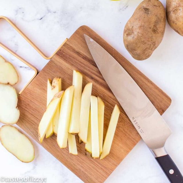 raw french fries on a cutting board