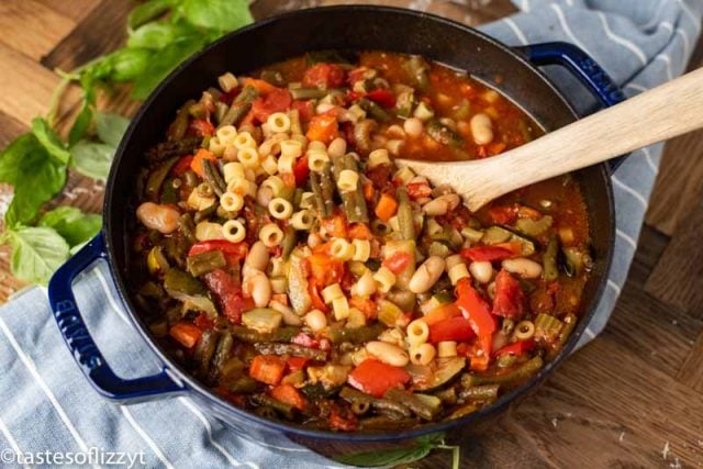 pot of soup with wooden spoon