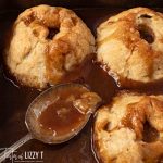 pan of apple dumplings with syrup