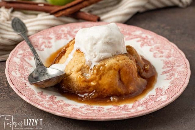 apple dumpling on a plate with a spoon