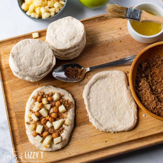 biscuits rolled out filled with brown sugar and apples