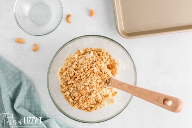cookie batter with cashews in a bowl
