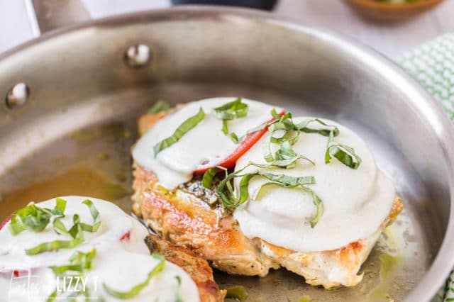 two chicken breasts in a skillet