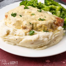 ranch pork chop on a plate with mashed potatoes