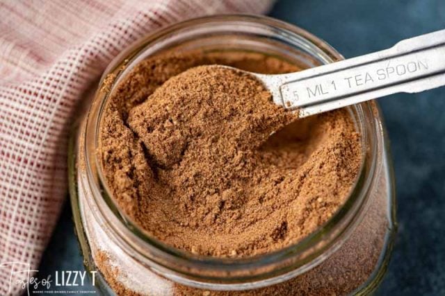 spices in a mason jar with measuring spoon