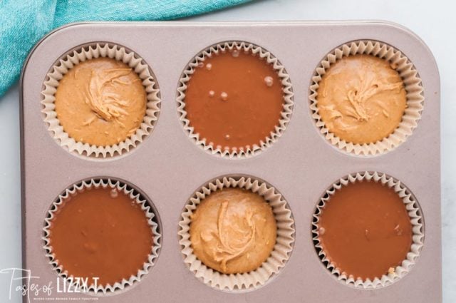 peanut butter cups half made in muffin pan